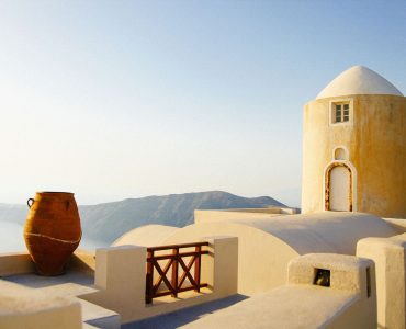 a large vase sitting on top of a building