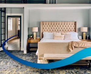 bedroom with a large bed and a balcony