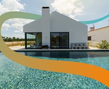 a house with a swimming pool in front of it