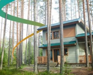 a house in the woods surrounded by tall trees