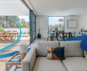 a living room filled with furniture and a large window