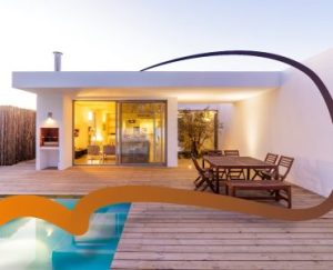 a modern house with a pool and patio