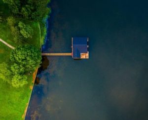 an aerial view of a house on a dock